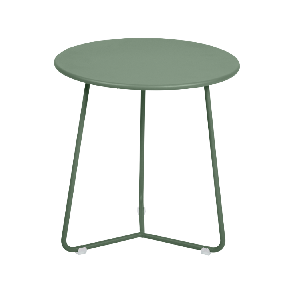 Une table d'appoint verte avec des pieds en métal.
