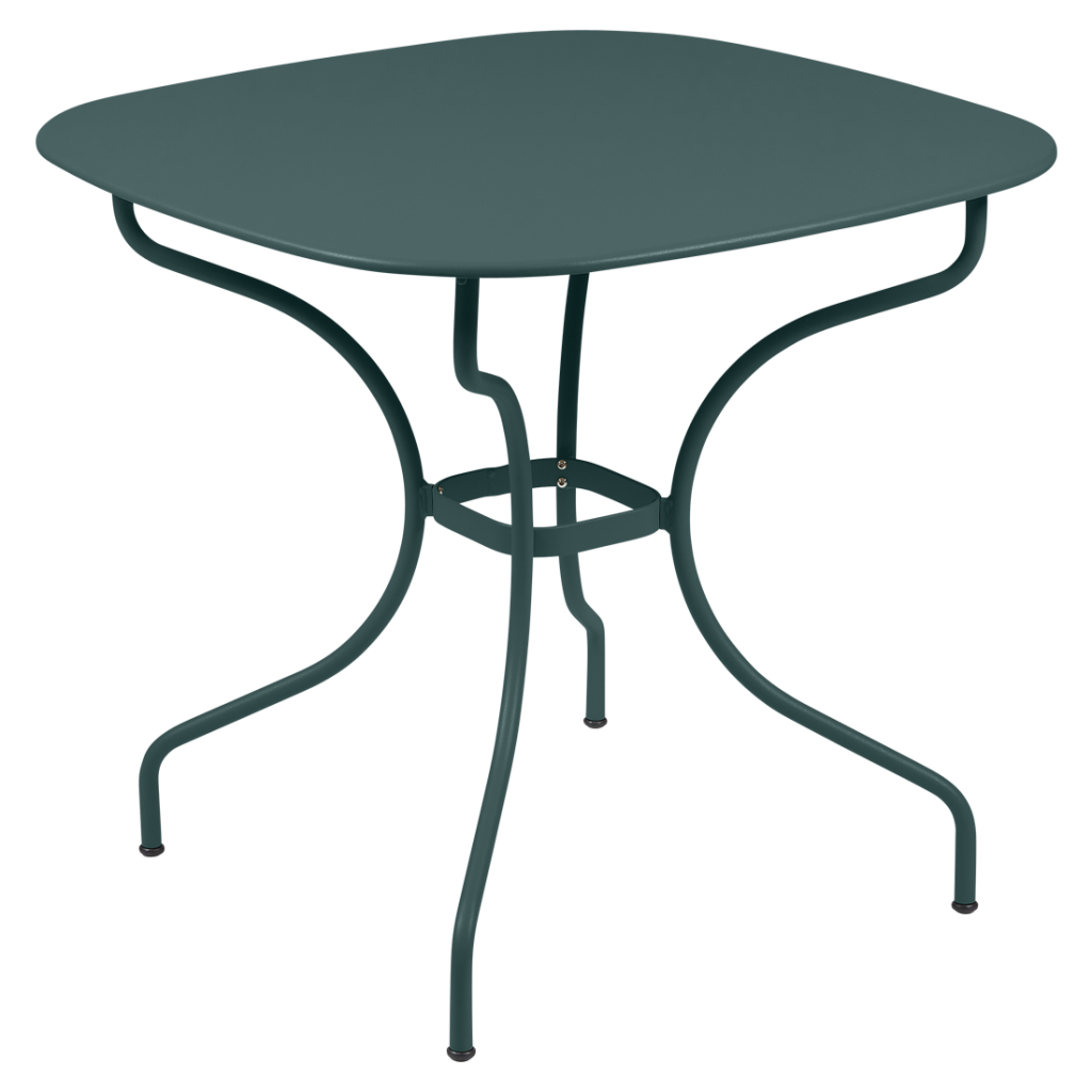 Une table en métal vert avec une base en métal.