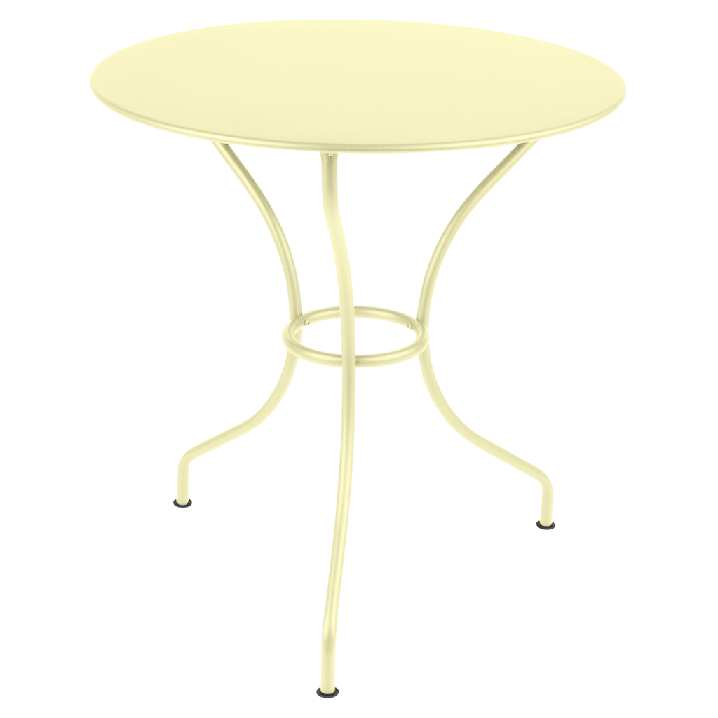 Une table ronde avec un piètement en métal jaune.