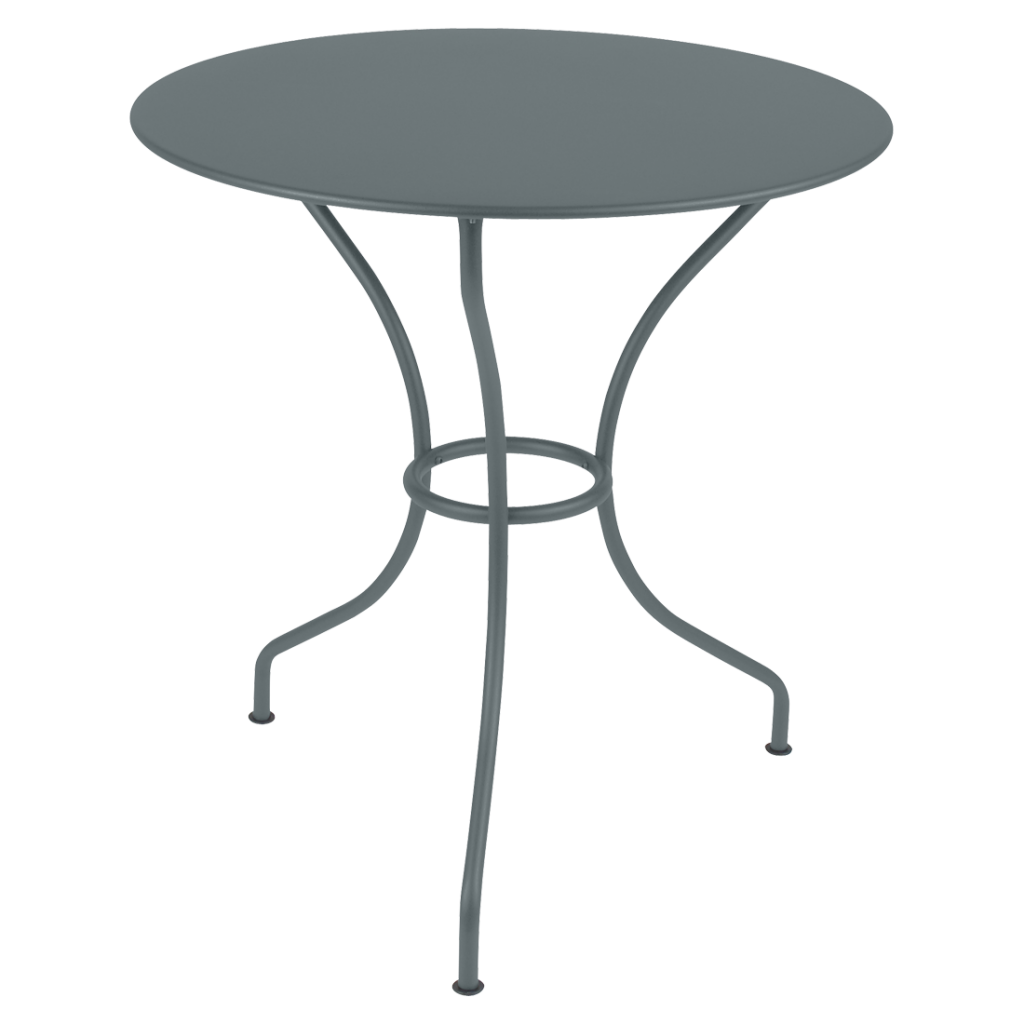 Une table ronde avec un piètement en métal gris.
