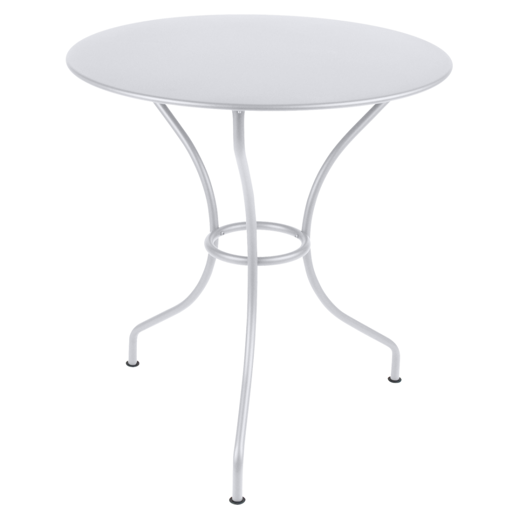 Une table en métal blanc avec un plateau rond.