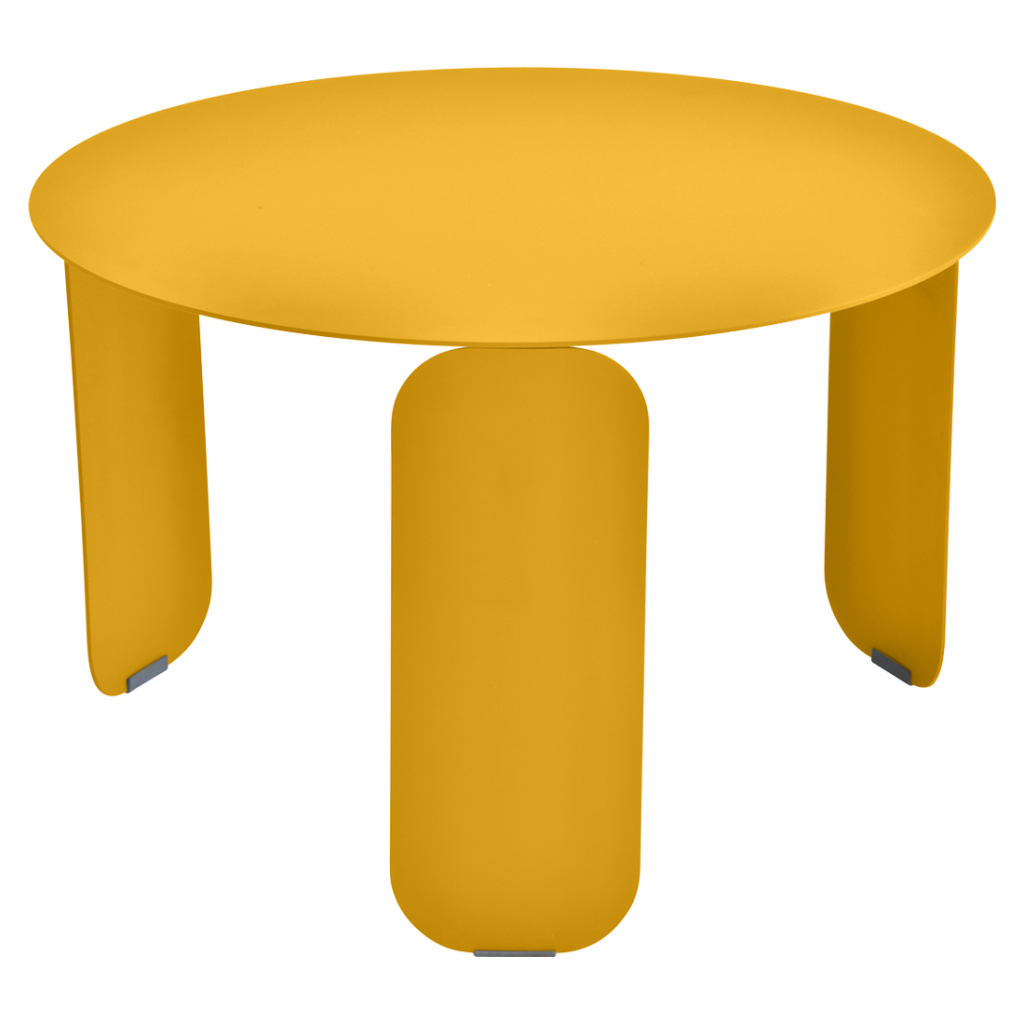 Une table ronde jaune avec deux pieds.