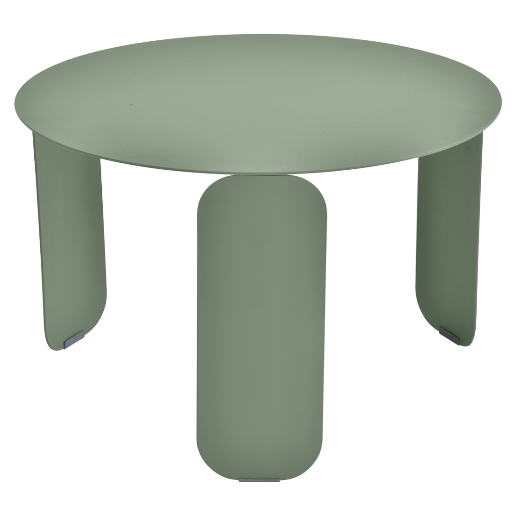 Une table ronde avec deux pieds de couleur vert clair.
