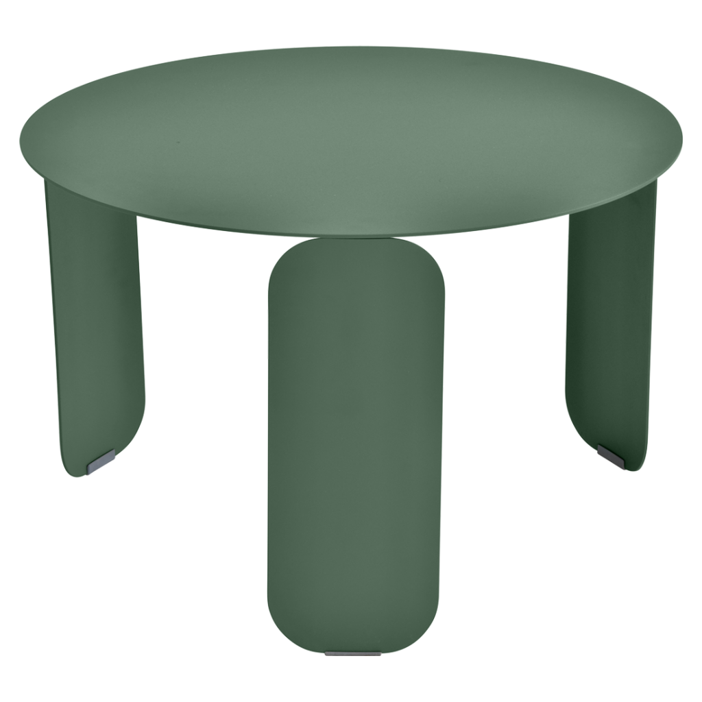 Une table ronde avec deux pieds de couleur vert foncé.