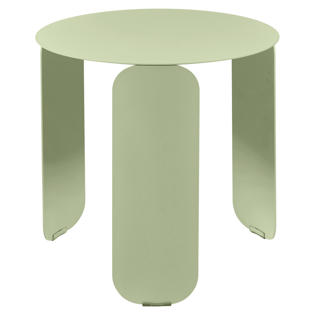 Une table ronde de couleur vert clair.