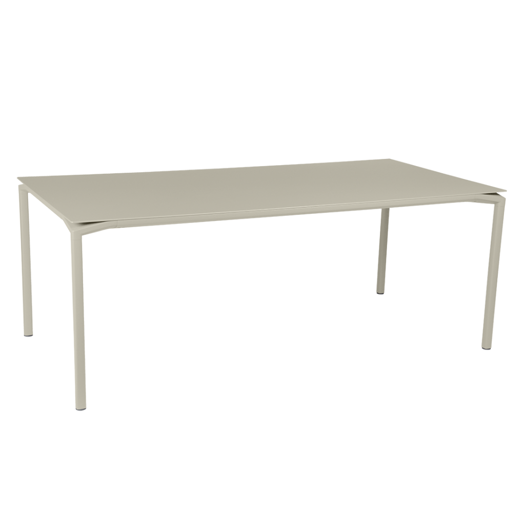 Une table rectangulaire avec un plateau beige.