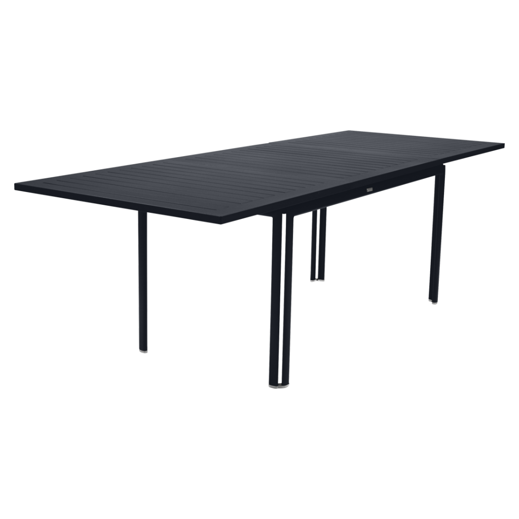 Une table à manger noire avec des pieds noirs.