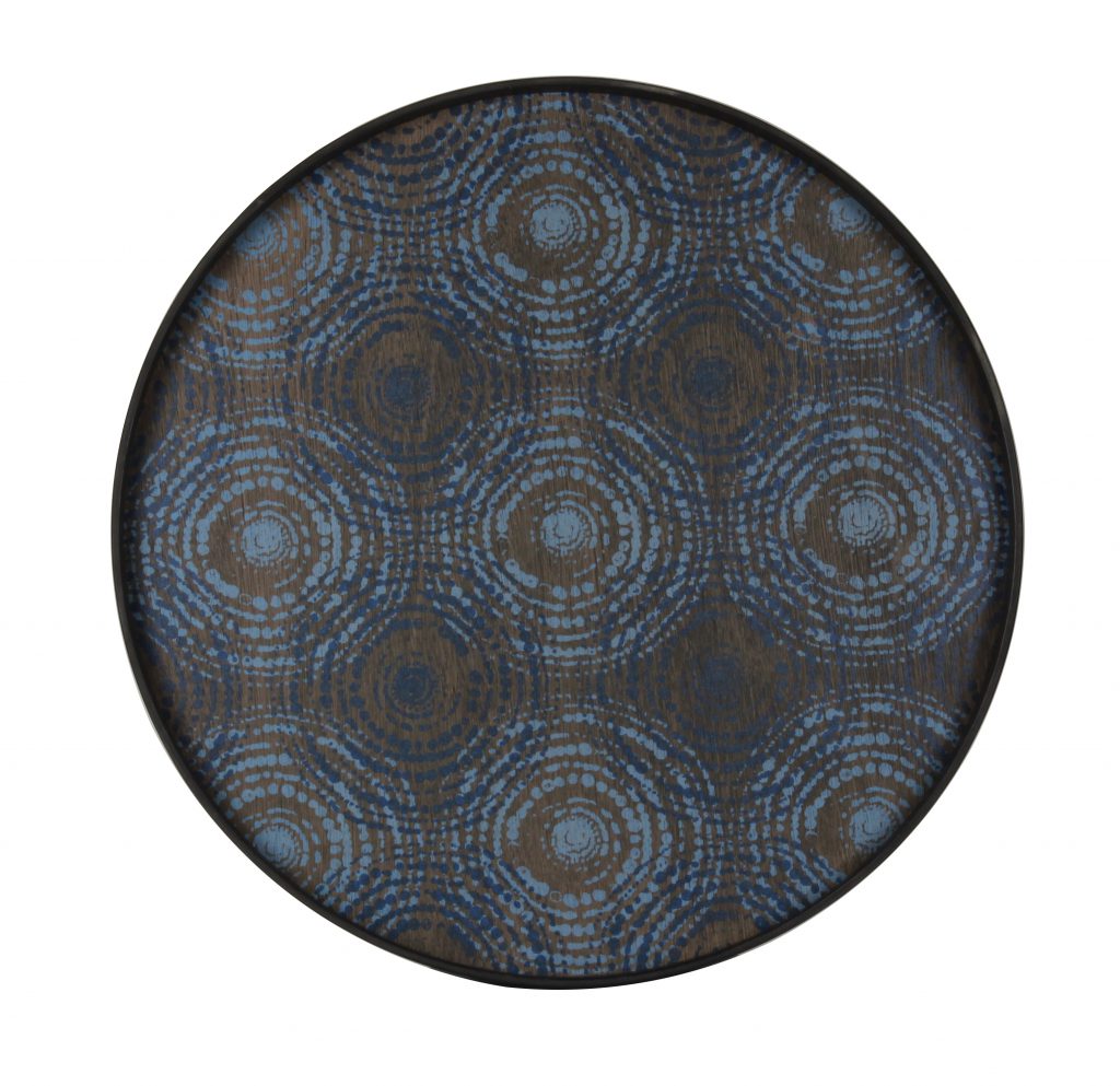 Un plateau rond avec des cercles bleus et marron dessus.