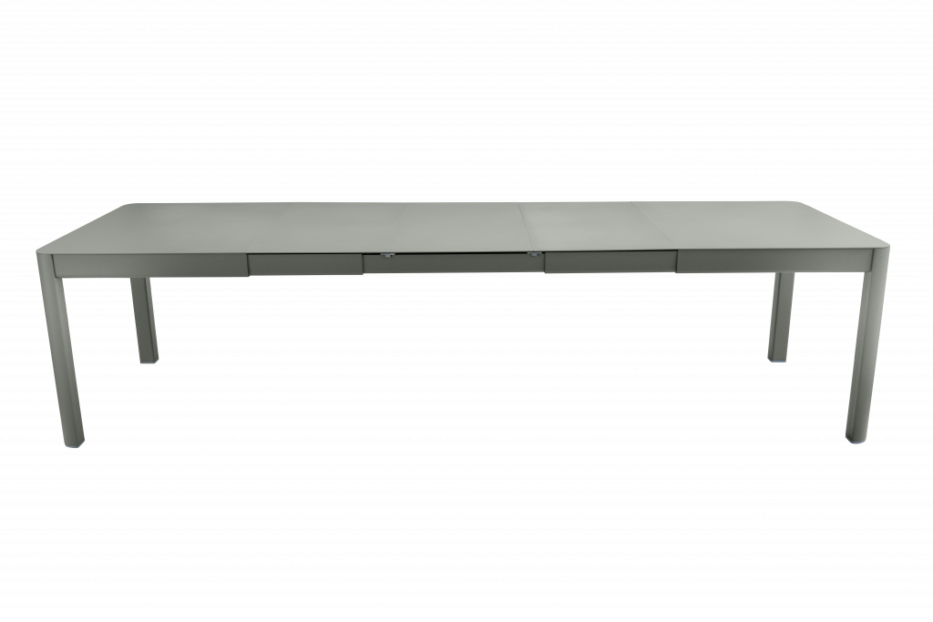 Image d’une table grise avec deux pieds sur fond noir.