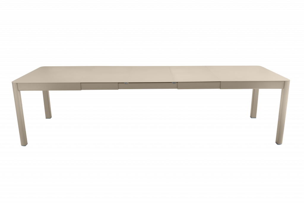 Une table à manger beige sur fond noir.