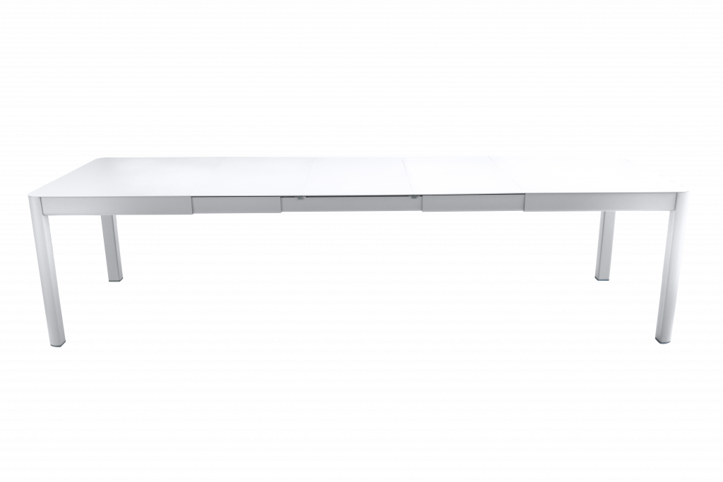 Une table à manger blanche sur fond noir.