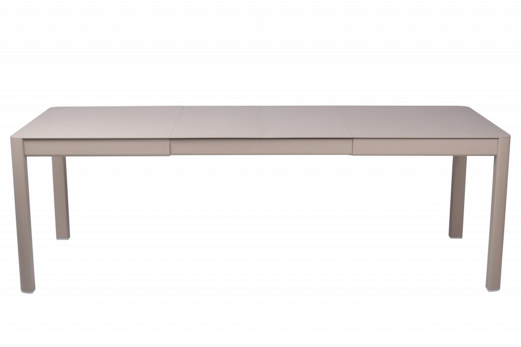 Une table beige à deux pieds sur fond noir.