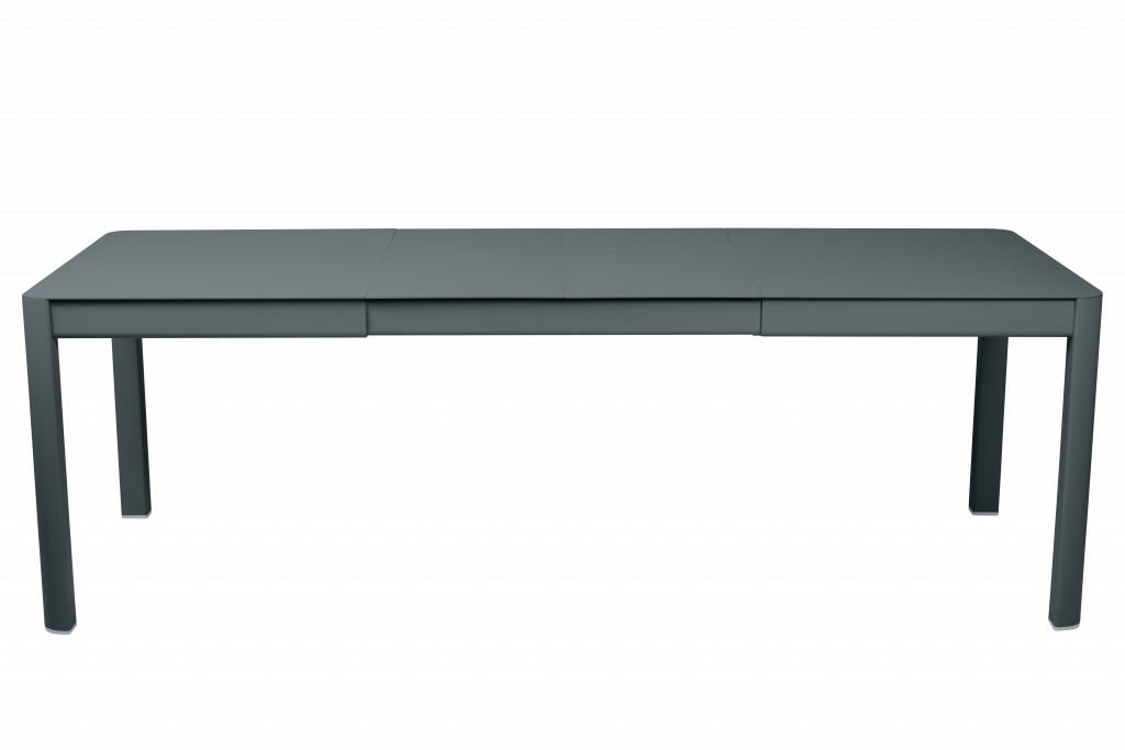 Un bureau gris avec deux tiroirs sur fond noir.