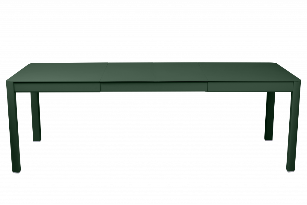 Un bureau vert avec deux tiroirs sur fond noir.