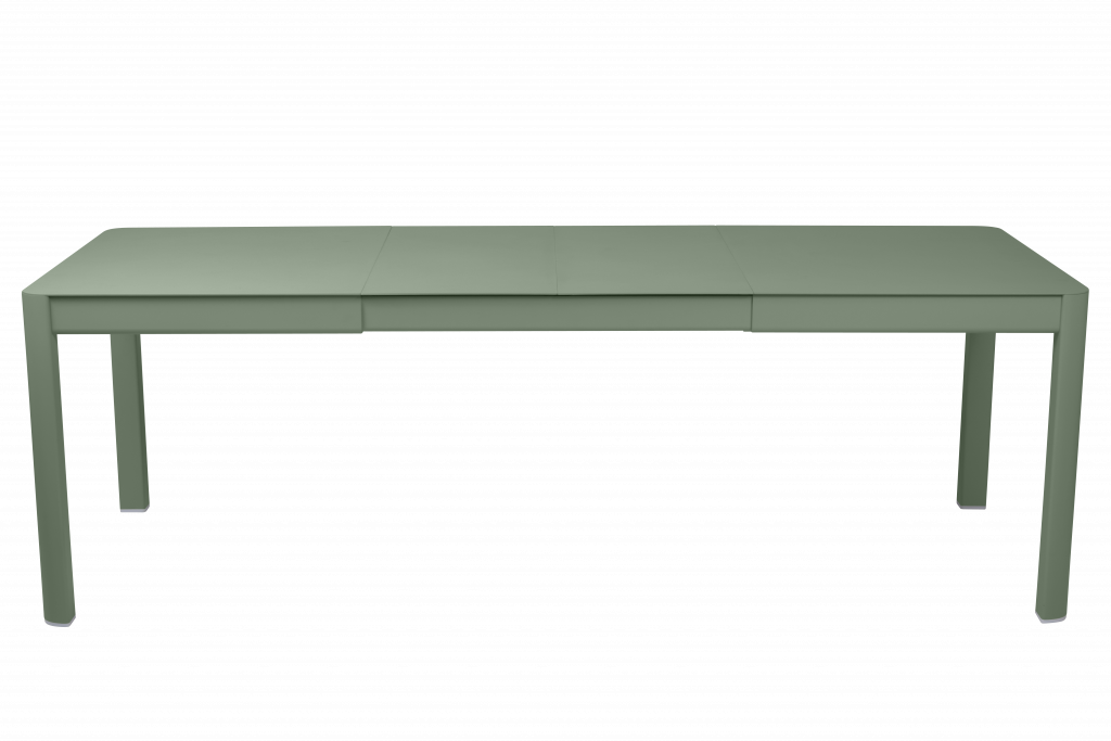 Un bureau vert avec deux tiroirs et un fond noir.