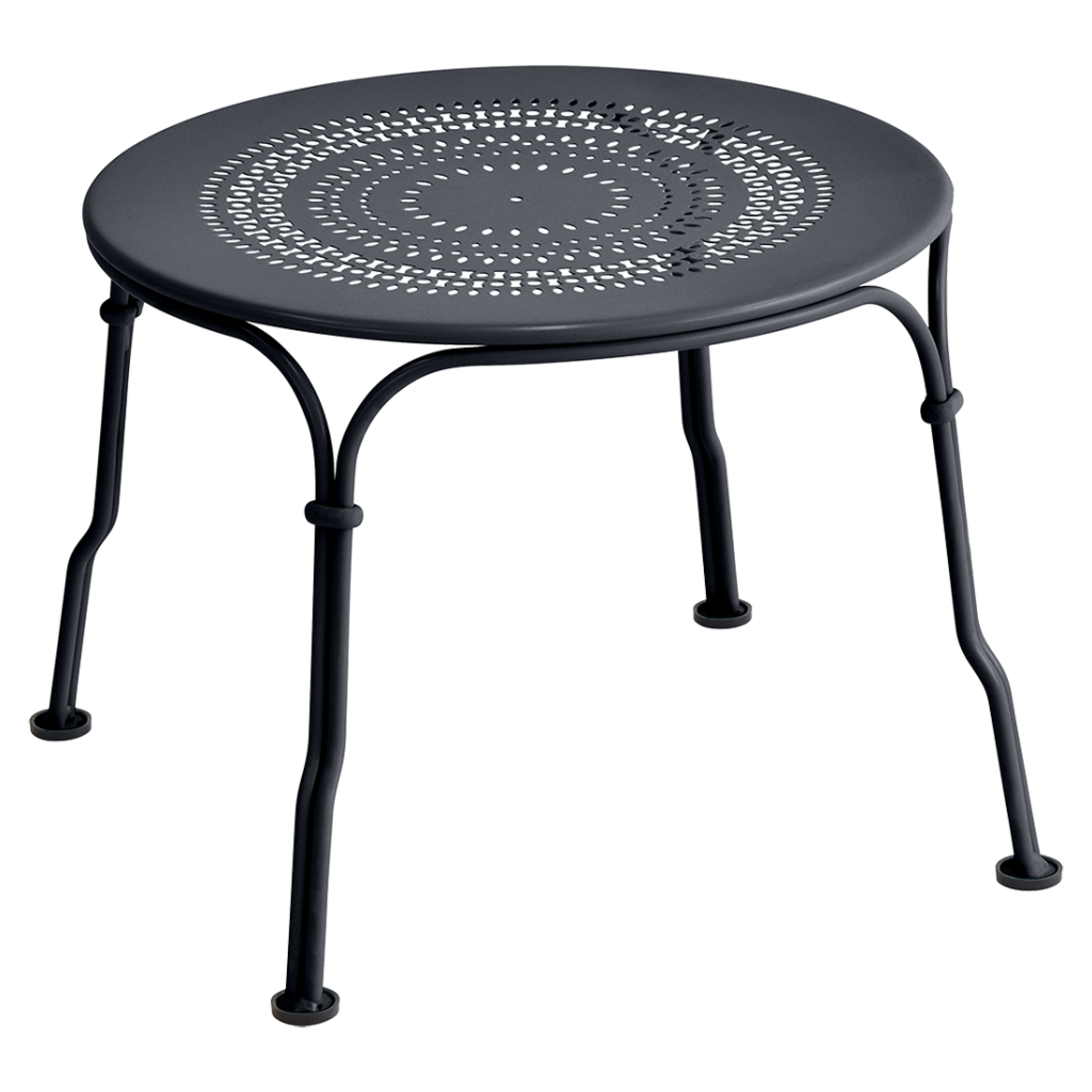 Une table en métal noir avec un plateau rond.
