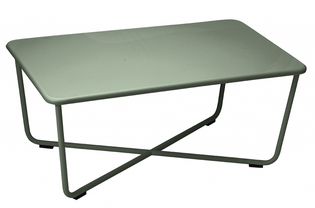 Une petite table verte avec des pieds en métal sur fond noir.