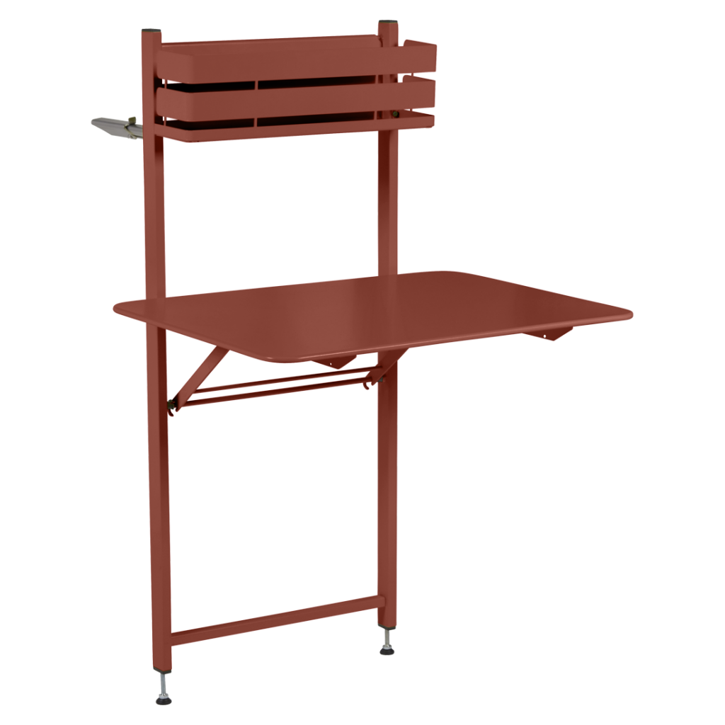 Une table en métal rouge avec une étagère dessus.