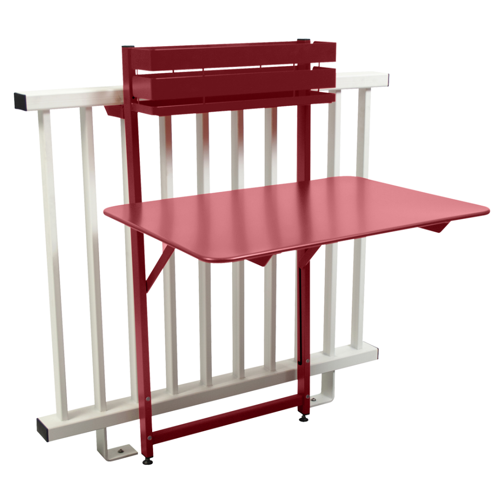 Une table rouge et blanche avec une étagère attachée.