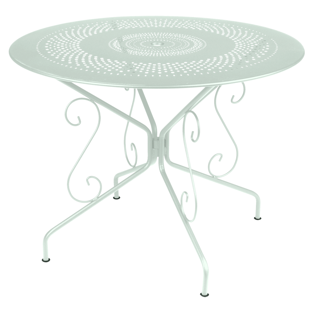 Une table en métal blanc au design fleuri.