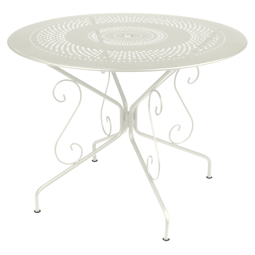 Une table en métal blanc au design fleuri.
