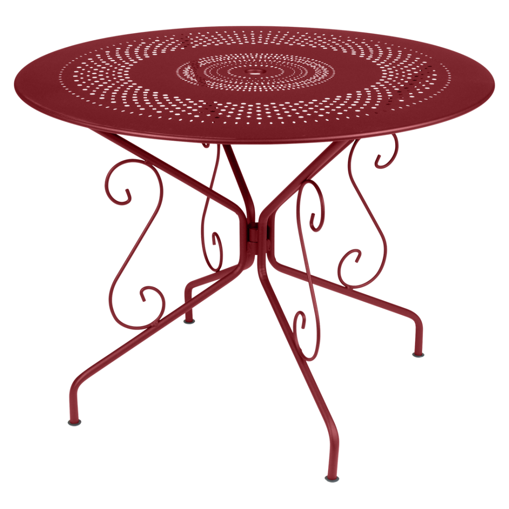 Une table en métal rouge au design circulaire.