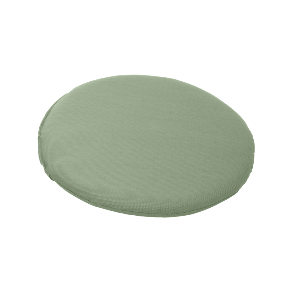 Un coussin rond vert sur fond blanc.