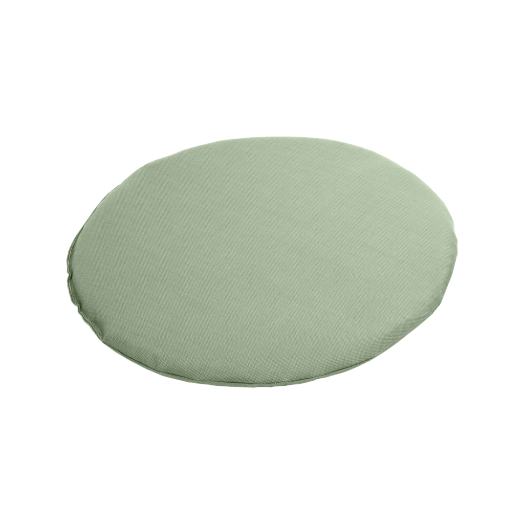 Un coussin rond vert sur fond blanc.