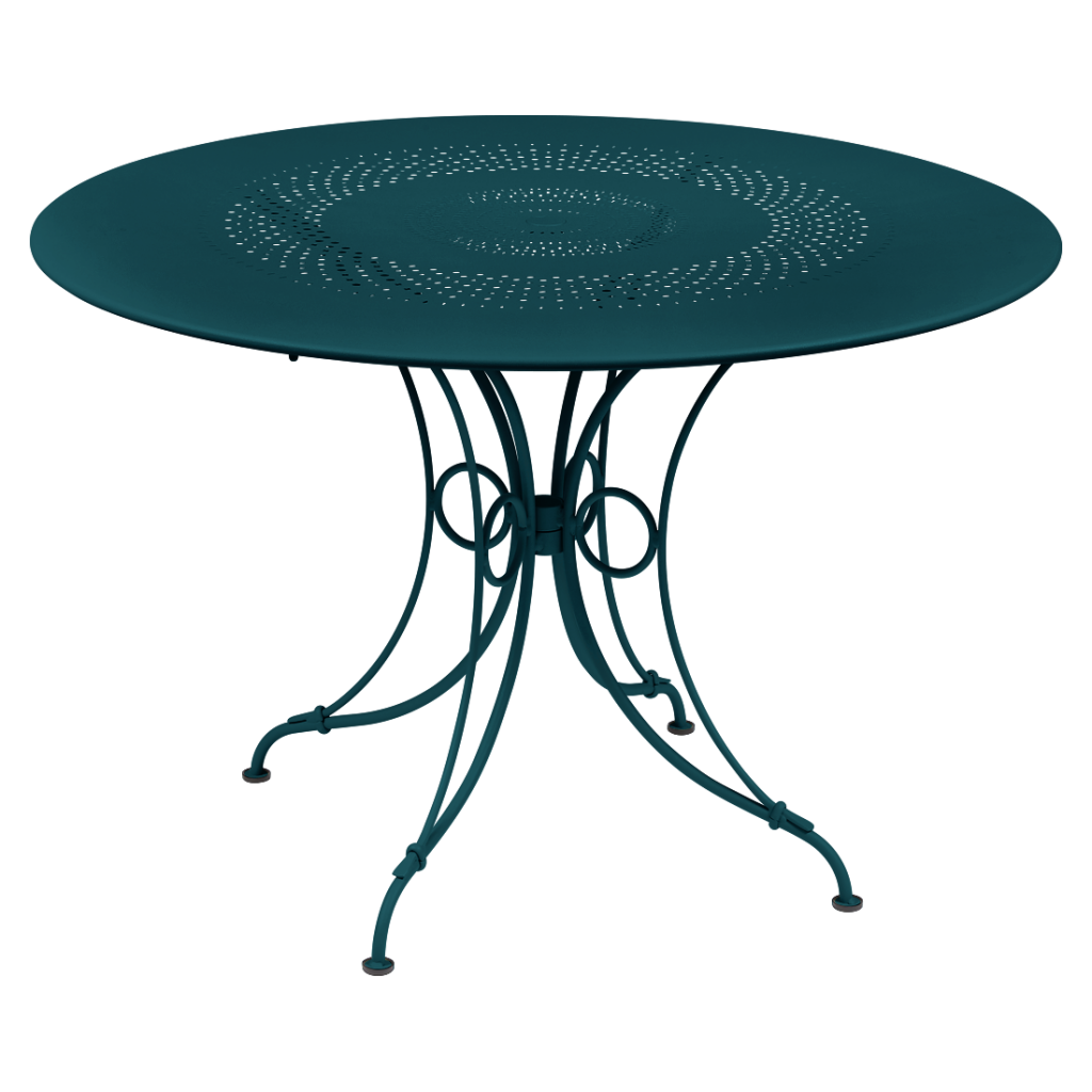 Une table ronde avec une base en métal de couleur bleu foncé.