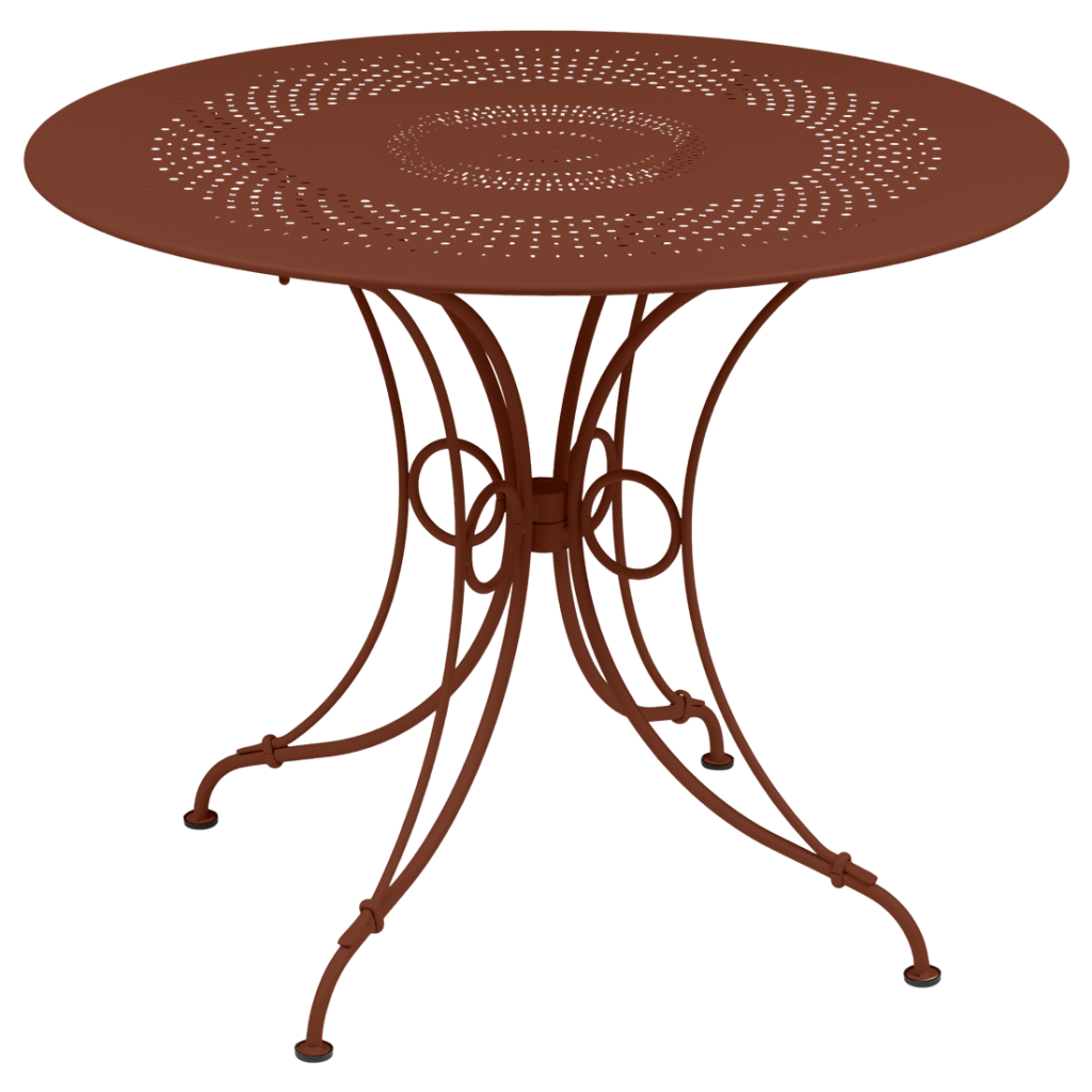 Une table ronde avec une base en métal marron.