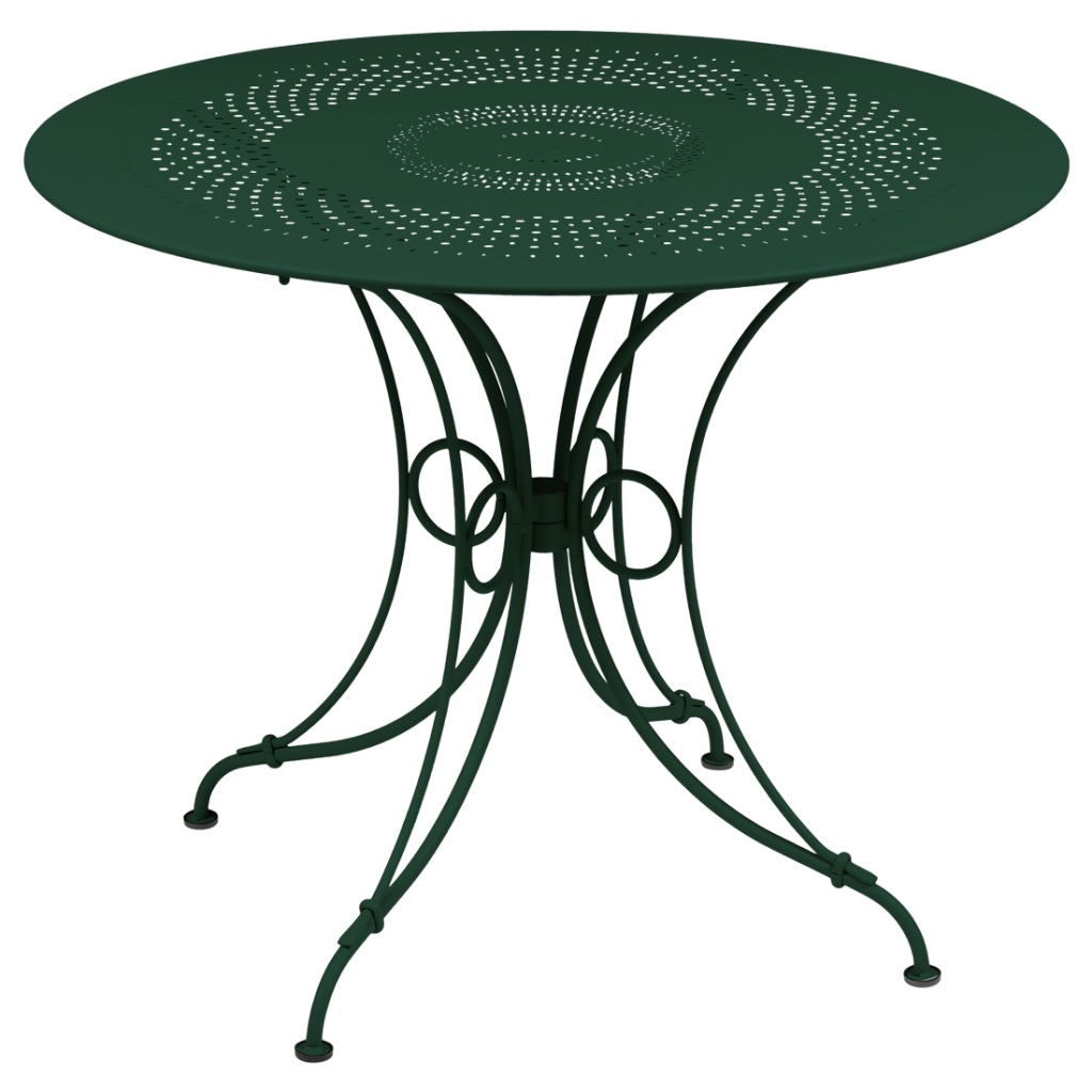 Une table ronde avec un piètement en métal vert.