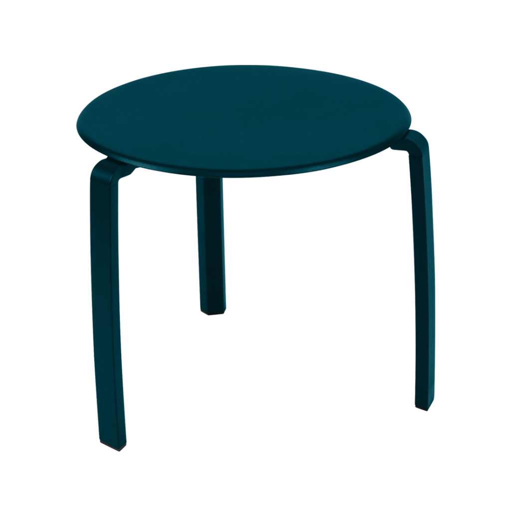 Une table d'appoint bleue avec des pieds noirs.