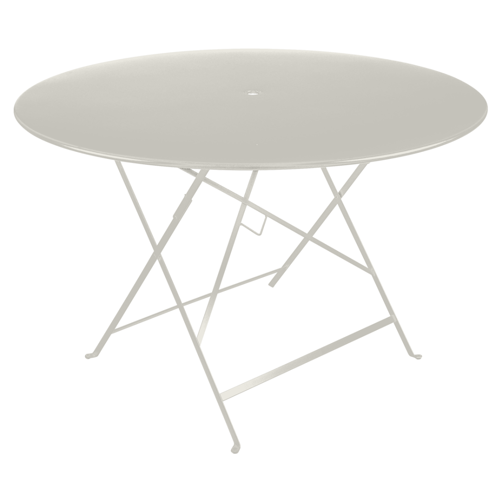 Une table ronde blanche avec un piètement en métal.