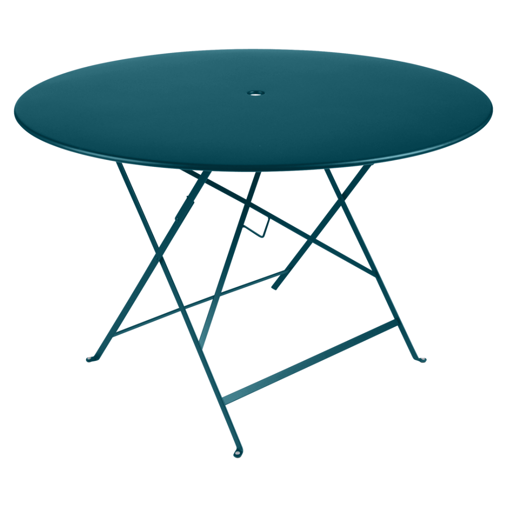 Une table ronde bleu sarcelle avec une base en métal.