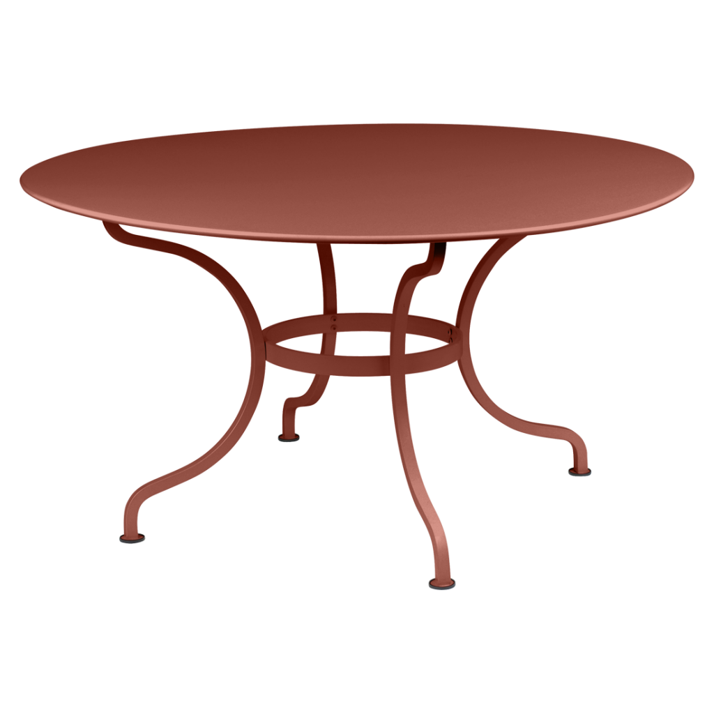 Une table ronde avec une base en métal.