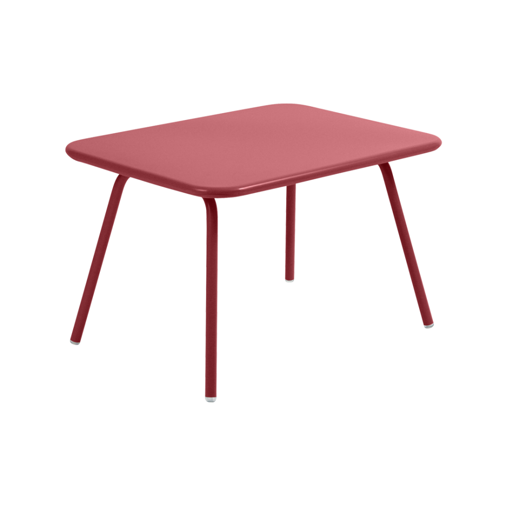 Une petite table rouge avec des pieds en métal.