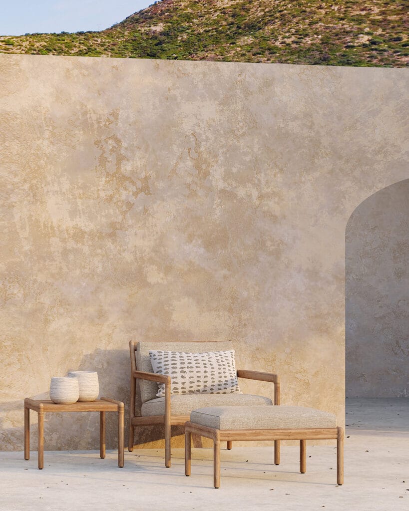 Le fauteuil de jardin Jack en teck avec une table.