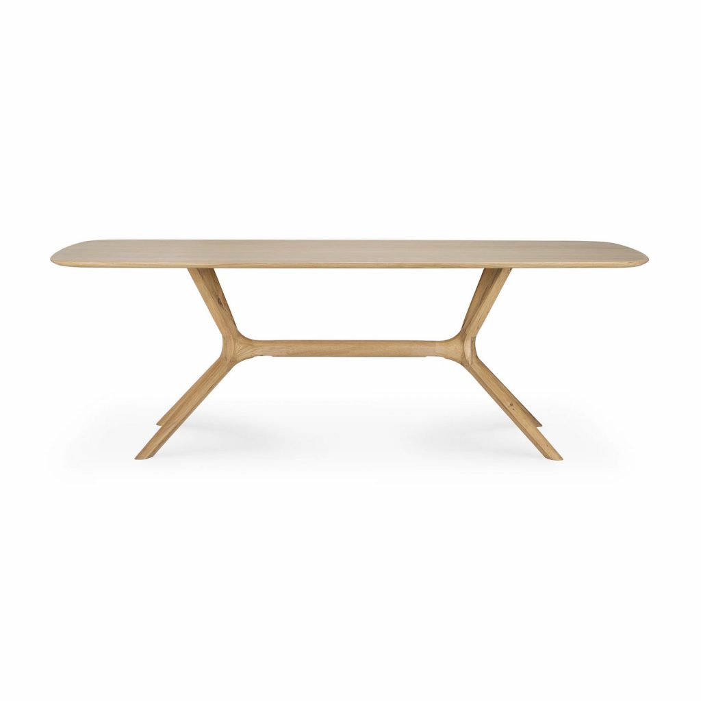Une table à manger avec un plateau et des pieds en bois.