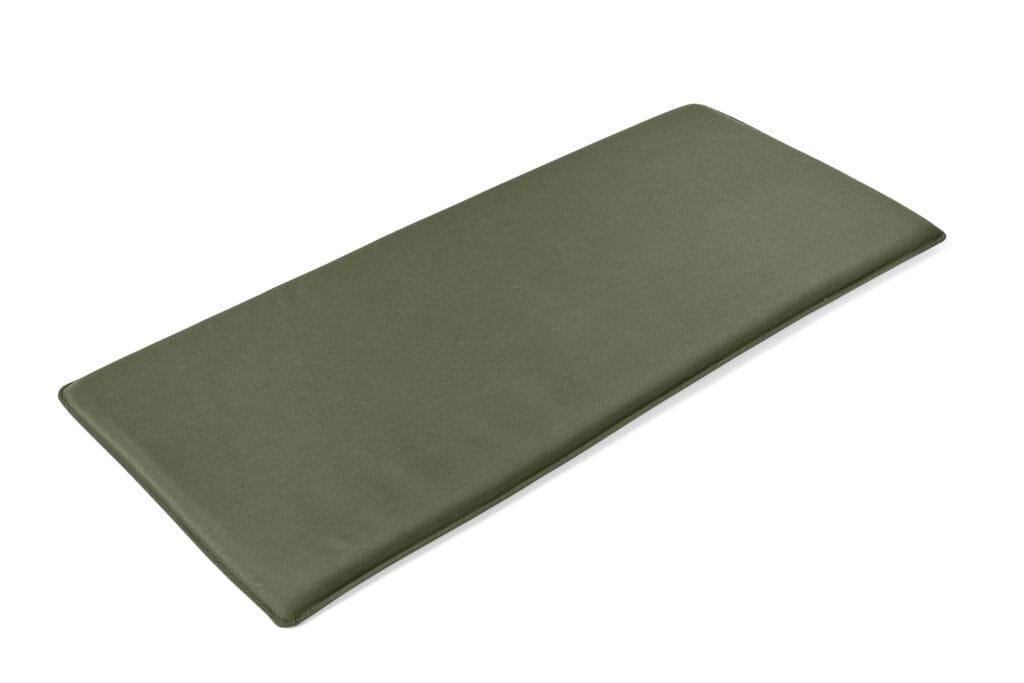 Un coussin d'assise vert sur fond blanc, parfait pour votre canapé Palissade.
