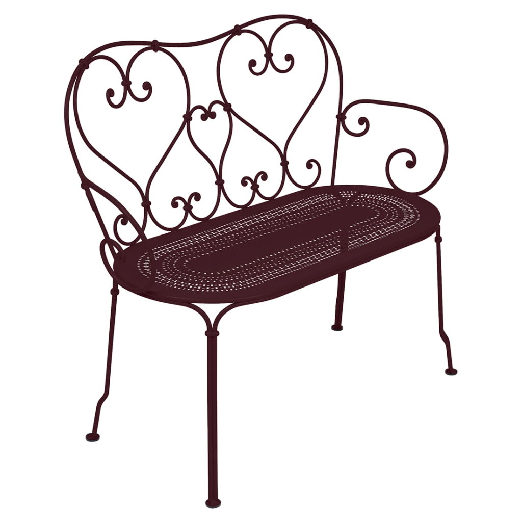 Un banc en fer forgé sur fond blanc, aux couleurs Cerise noire.