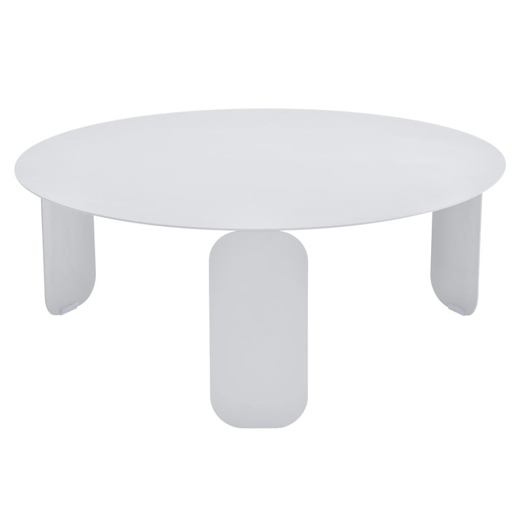 Une Table basse Bebop ronde blanche avec pieds roses, diamètre 80 cm.