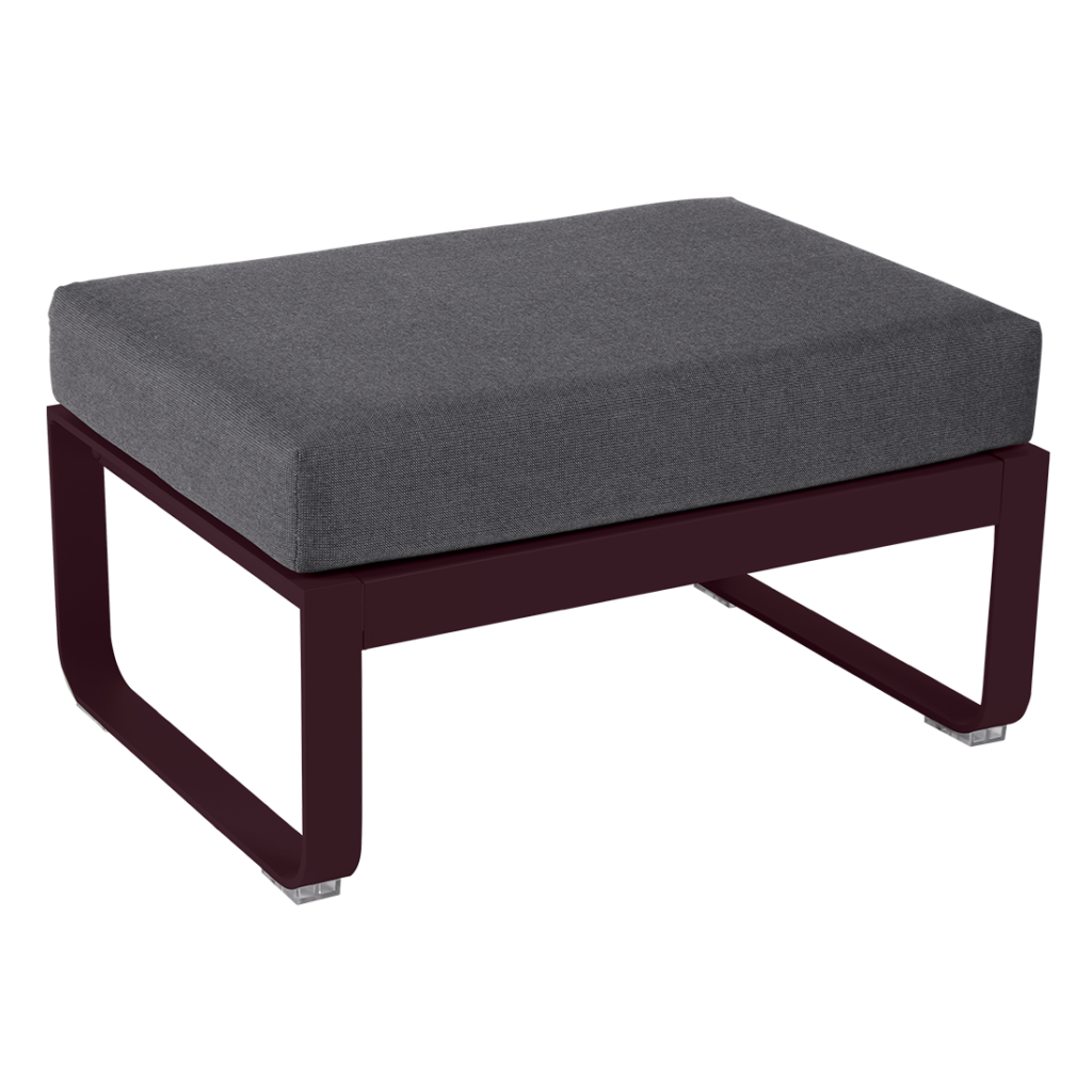 Un pouf gris foncé avec un coussin sur le dessus.