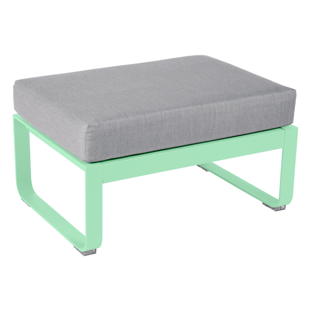 Un pouf vert et gris avec un coussin.