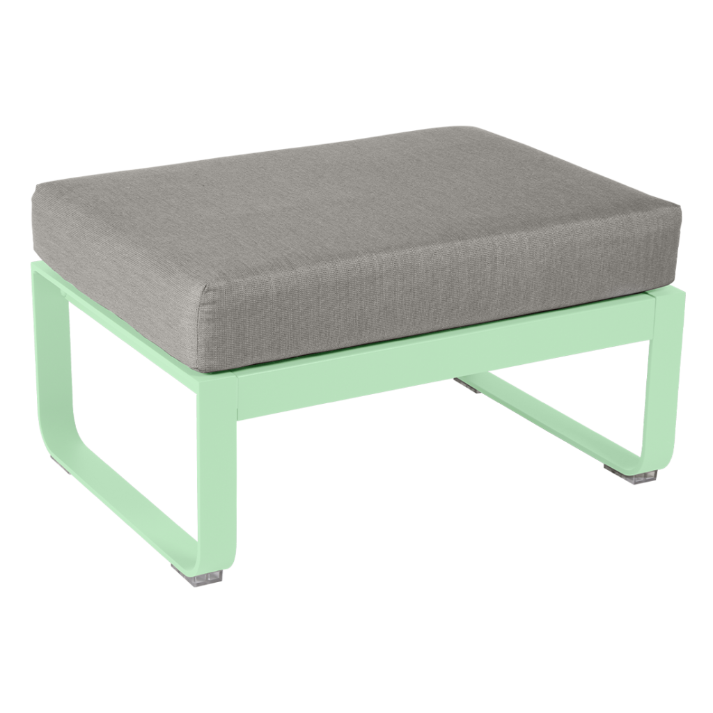 Un pouf vert et gris avec un coussin.