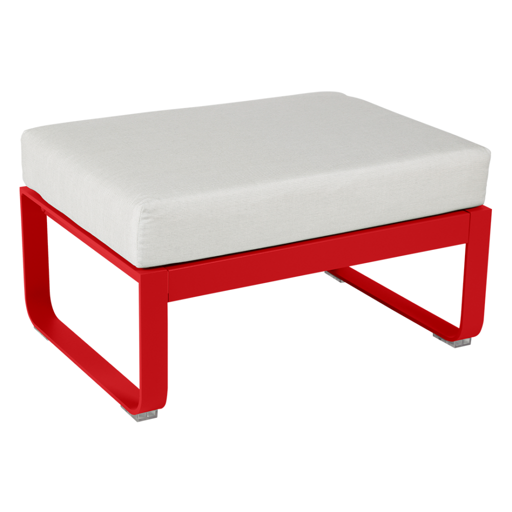 Un pouf rouge et blanc avec un coussin blanc.
