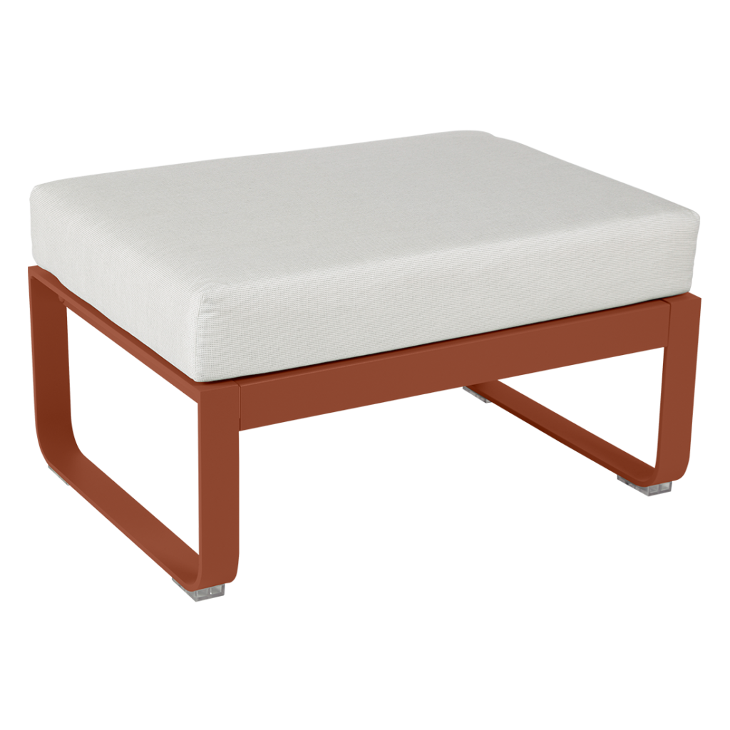 Un pouf orange et blanc avec un coussin blanc.