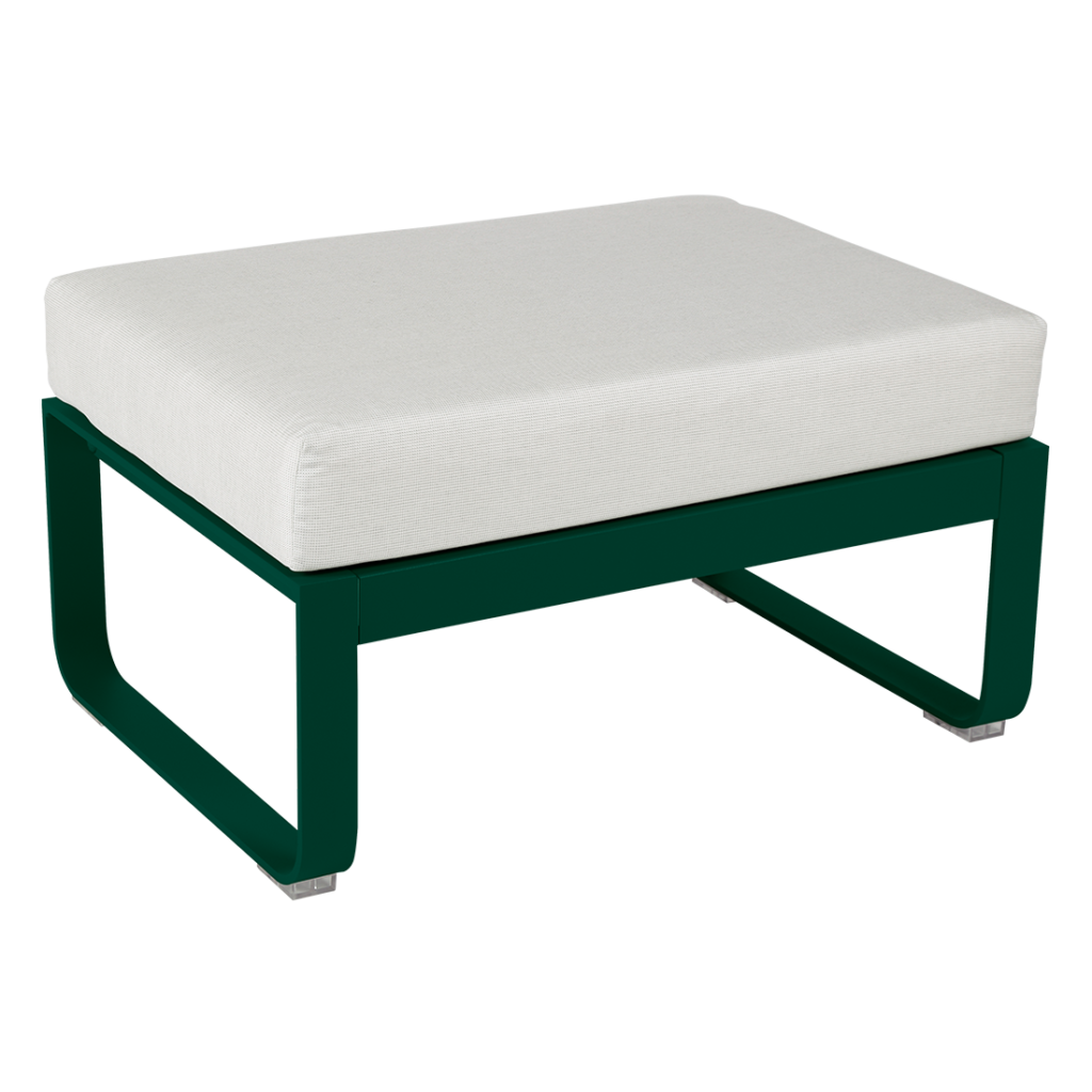 Un pouf vert et blanc avec un coussin blanc.