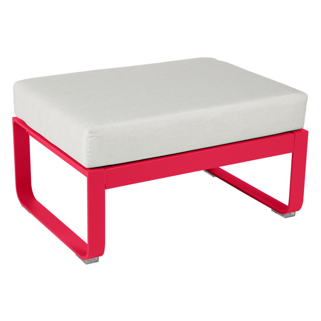 Un pouf rouge et blanc avec un coussin blanc.