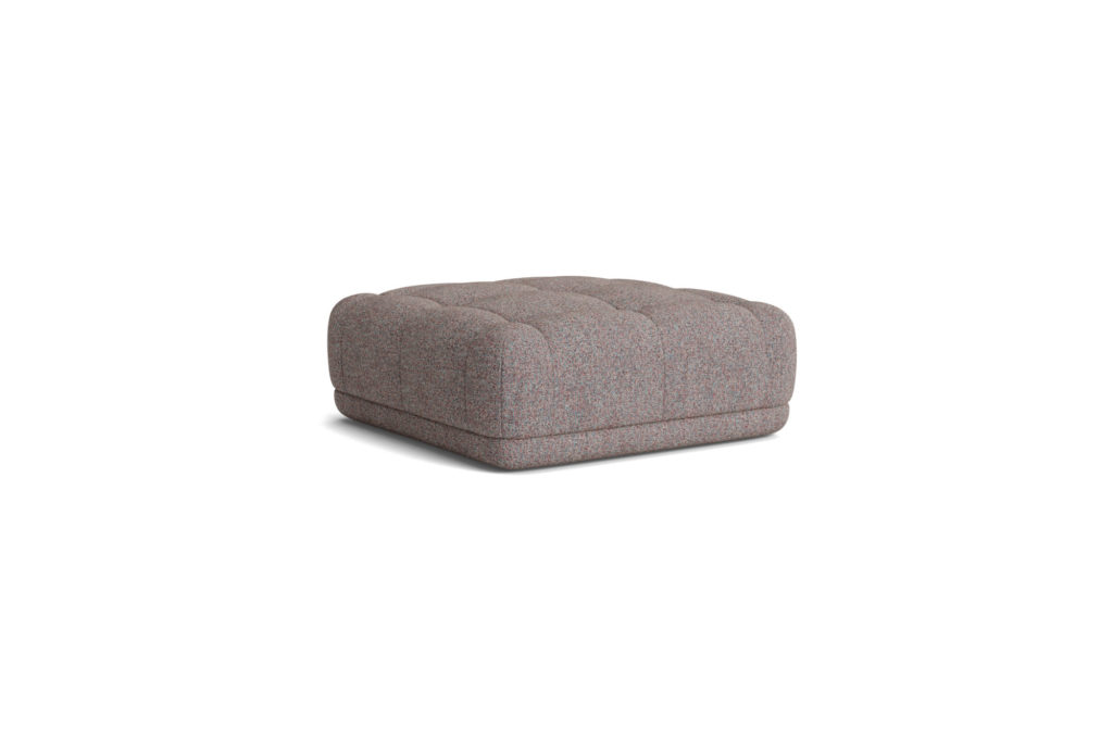 Un petit pouf Pouf Quilton gris sur fond blanc.
