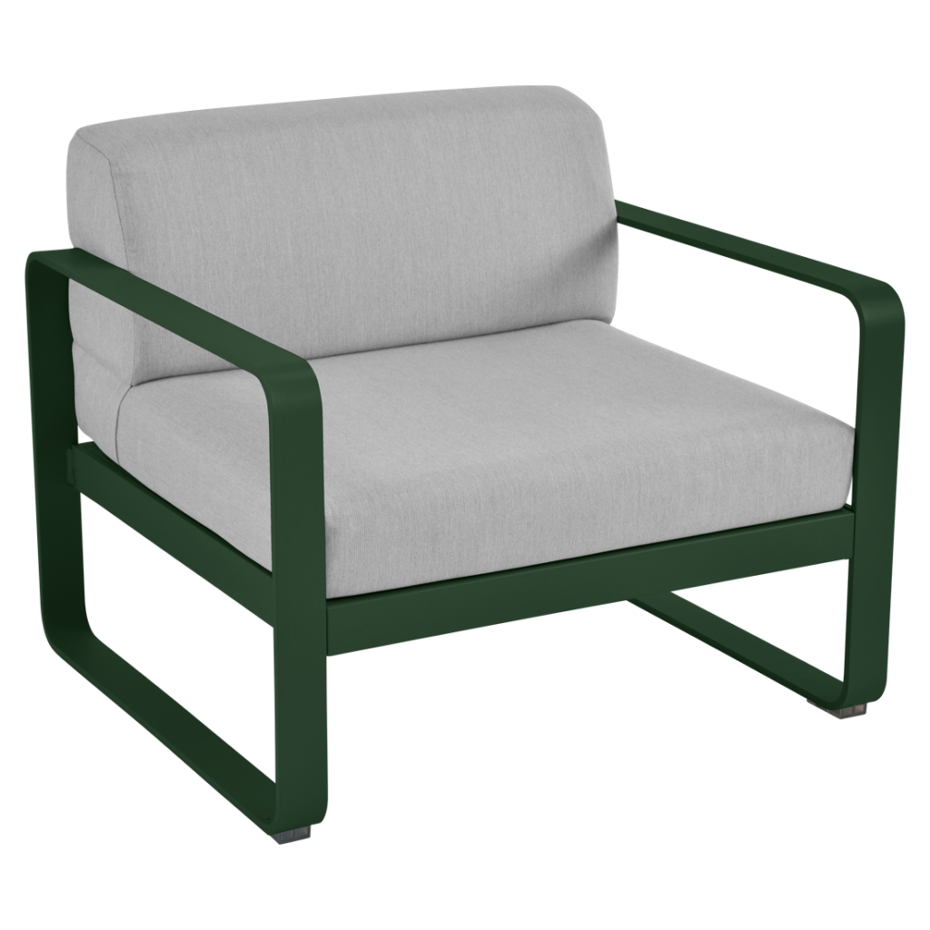 Une chaise longue verte avec un coussin blanc.